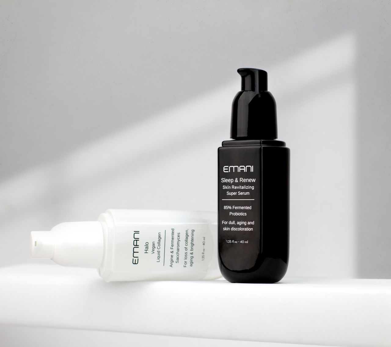 Studio shot of Emani skincare serums on a white background showcasing luxury beauty products.